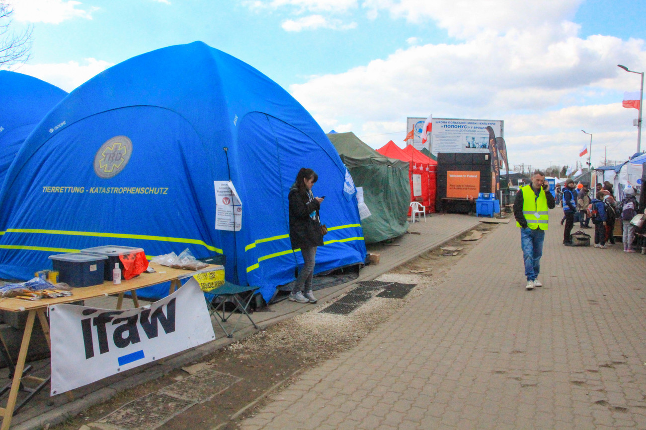 The blue IFAW tent on the humanitarian footpath at the Medyka, Poland border crossing.